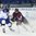 POPRAD, SLOVAKIA - APRIL 15: Slovakia's Martin Kupec #4 checks Latvia's Daniels Berzins #12 during preliminary round action at the 2017 IIHF Ice Hockey U18 World Championship. (Photo by Andrea Cardin/HHOF-IIHF Images)